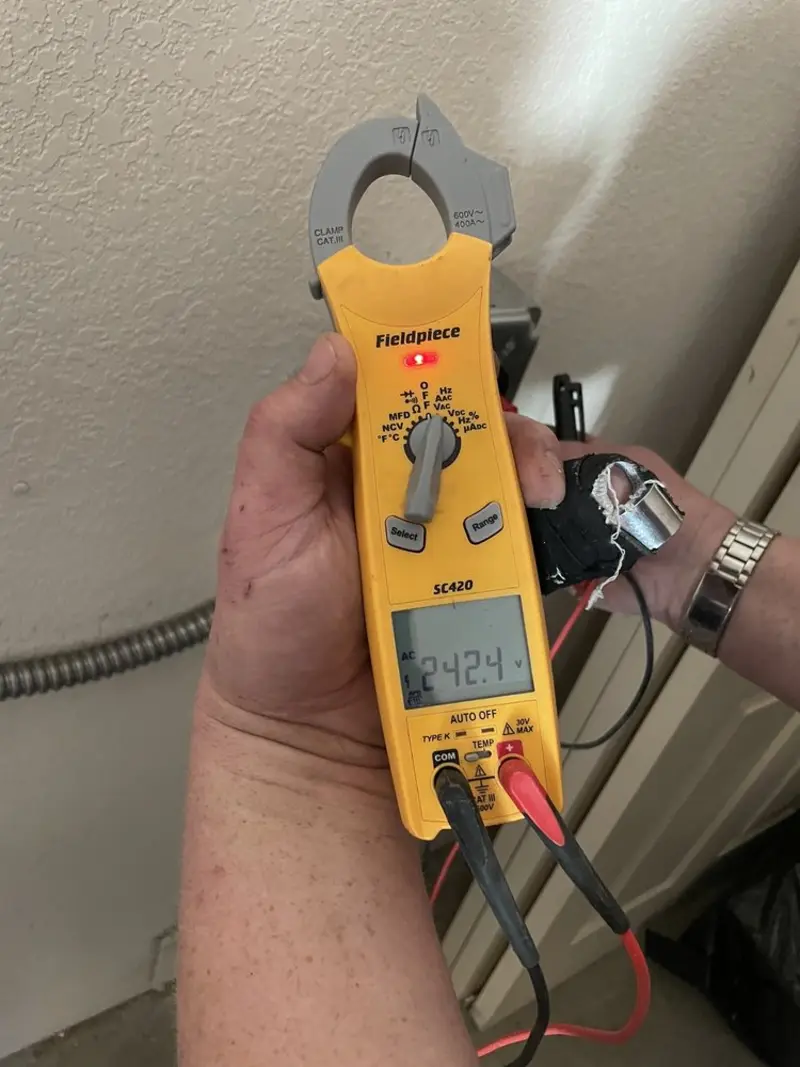 Voltage testing with clamp meter during Outlet Installation in Wheatland
